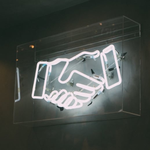 neon handshake sign