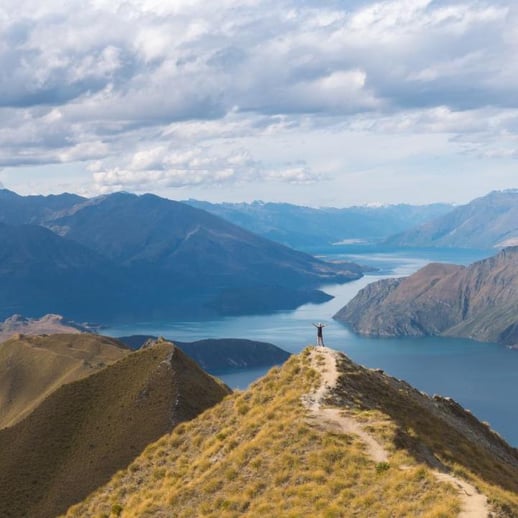 hiker at the top of a mountain