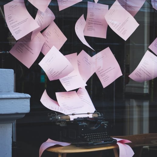 pages flying out of a typewriter